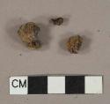 2 ferrous metal fragments, likely nails, 1 slag fragment