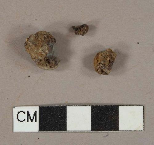 2 ferrous metal fragments, likely nails, 1 slag fragment