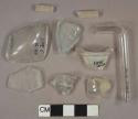 Colorless glass fragments, 2 rod fragments, 1 prescription lip fragment, 1 tube fragment, 1 aqua vessel fragment