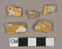 Yellow slip glazed redware vessel body fragments