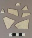 Undecorated whiteware body sherds; two sherds crossmend