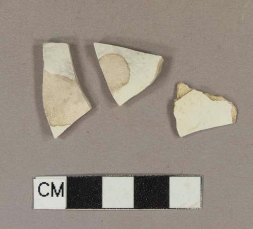 Undecorated creamware body sherds; two sherds crossmend