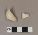 Unsmoked pipe bowl fragments, stamped or incised with cartouche; one fragment has raised stamped design