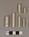 Unsmoked, undecorated pipe stem fragments; two fragments crossmend; 5/64" bore diameter