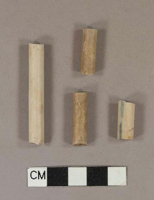 Smoked, undecorated pipe stem fragments; two fragments crossmend; 5/64" bore diameter