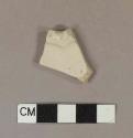 Molded white salt glaze stoneware rim sherd