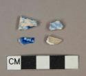 Blue on white transferprinted earthenware vessel body and rim fragments, light buff paste