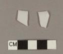 Milk white bottle glass fragments; two fragments crossmend