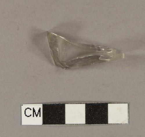 Colorless bottle glass fragment; part of rectangular bottle