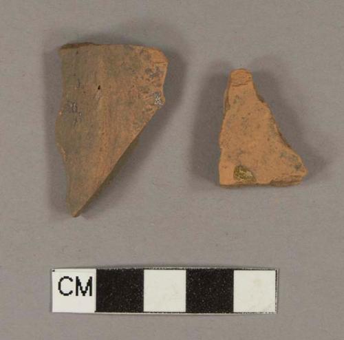 Undecorated lead glazed redware base sherds