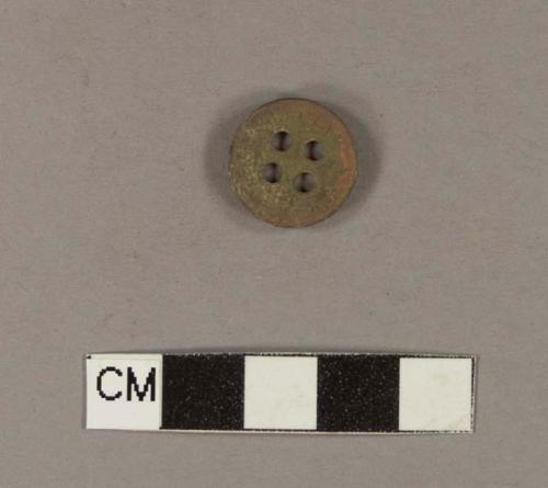 Four-hole copper alloy button; stamped with "SPECIAL ORDER"