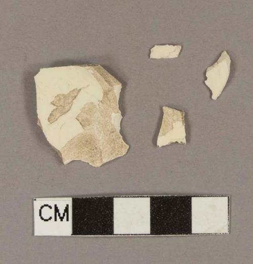 Undecorated creamware body sherds; two sherds crossmend