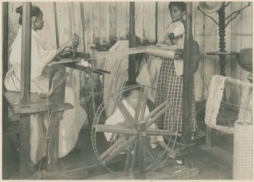 Women weaving and spinning