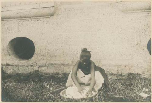 Woman washing clothes