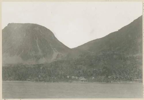 Saddle, Camiguin Volcano and Mount Catarman, with buildings along shore