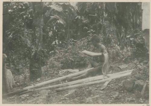 Man throwing Manila hemp fiber strip