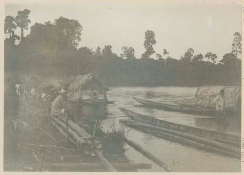 Men transporting hemp by raft