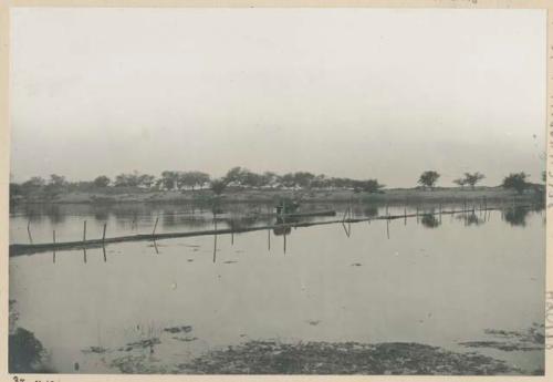 Floating bamboo bridge and bamboo raft