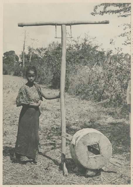 Tagalog girl with hulling machine