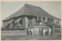 Group of men in front of house of Overseer, Government Rice Farm