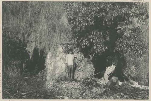 Man standing next to tunnel on Buckhorn claim, Bua Mining Co.