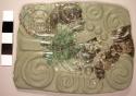 Portions of engraved jadeite tablet