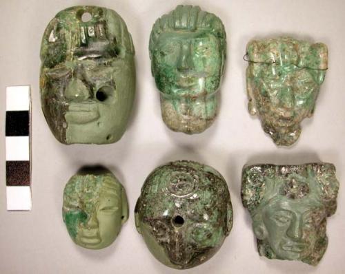 Portion of carved jadeite ornament, human face