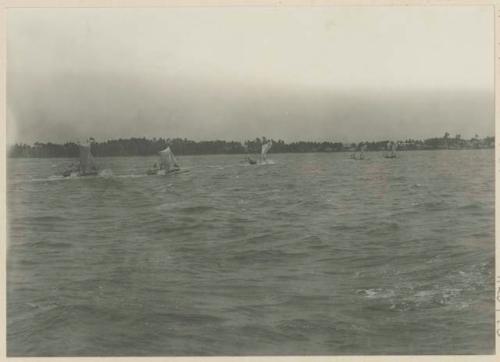 Sail boats running to shore at Bacolod