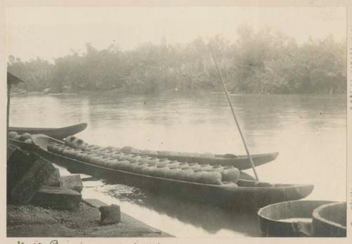 Boats transporting sap to distillery