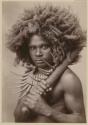 Studio staged portrait of man with club