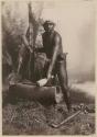 Studio staged portrait of man beating drum