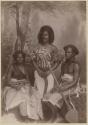 Studio staged portrait of two men and one woman