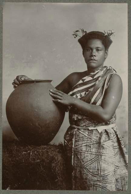 Studio staged portrait of Fijian with vessel