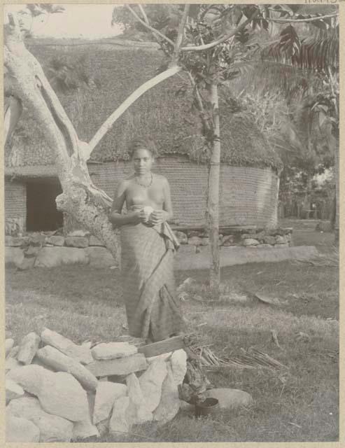 Woman standing outside structure