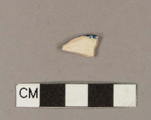 Molded, blue hand painted pearlware rim sherd