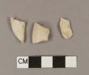 Smoked, undecorated pipe bowl fragments; one may possibly have incised decoration