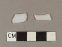 Milk white bottle glass fragments