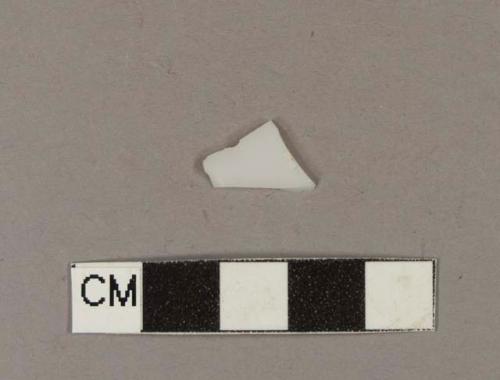 Milk white bottle glass fragment