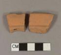 Unglazed, undecorated redware rim sherds; likely flowerpot rim; two sherds crossmend