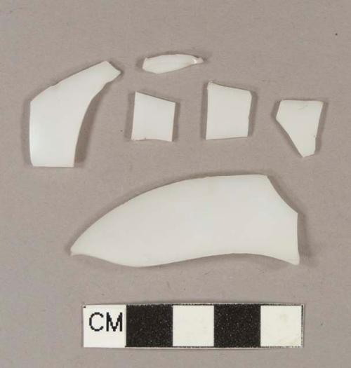 Milk white bottle glass fragments