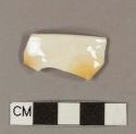 Molded ironstone rim sherd; crossmends with body sherd (2008.22.1934)