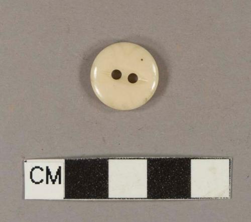 Cream-colored synthetic two-hole button