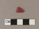 Red plastic fragment