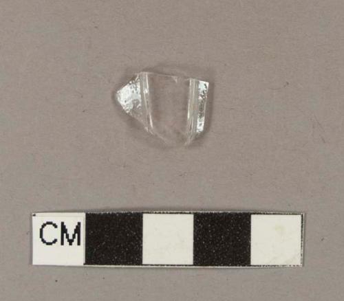 Paneled colorless bottle glass fragment