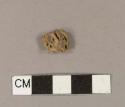 Fragment of nut shell or fruit pit