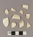 Undecorated creamware body sherds; two sherds crossmend