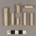 Unsmoked, undecorated pipe stem fragments; 5/64" bore diameter; two fragments crossmend