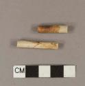 Unsmoked, brown glazed or stained pipe stem fragments; 5/64" bore diameter; two fragments crossmend