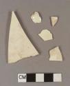 Undecorated creamware body sherds; three sherds crossmend