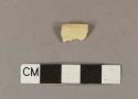 Undecorated creamware footring sherd